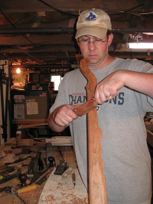 Brian shaping the neck on his first banjo, built in 2008.